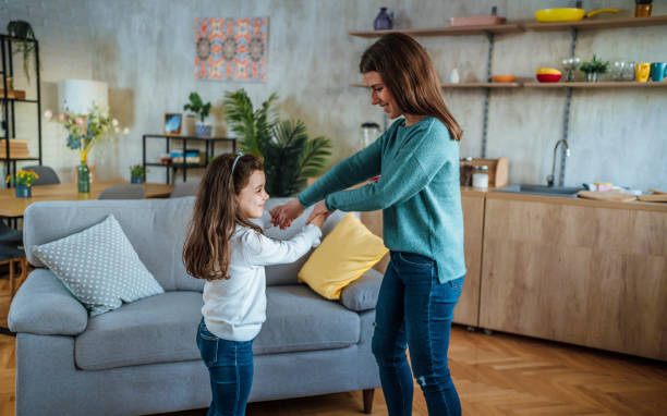 istock Mother and little daughter having fun at home 1445791783