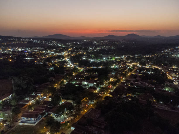 istock amazing orange sunset in small historic town with lights already on 1445793918