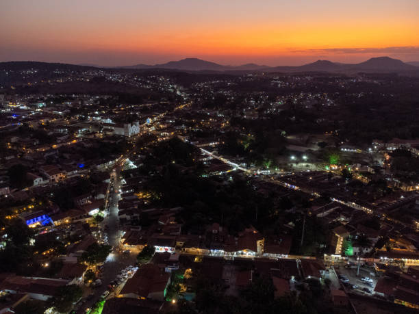 istock amazing orange sunset in small historic town with lights already on 1445793945