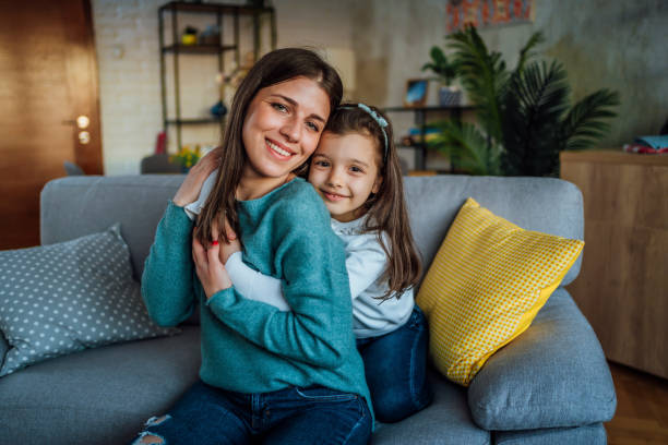 istock Mother and daughter hugging at home 1445794771