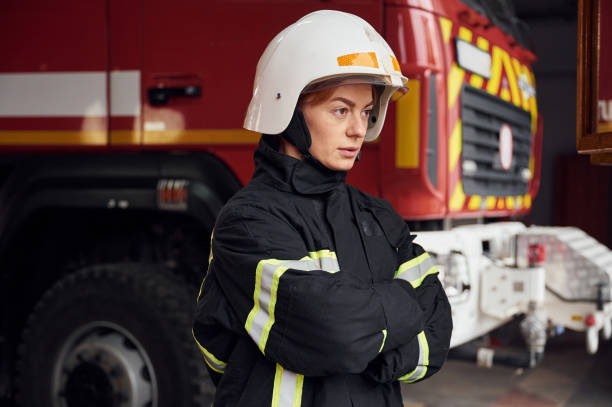 istock Woman firefighter in uniform is at work in department 1445795036