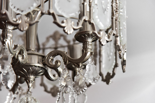 Silver chrystal chandelier close-up view. Indoor electric decoration chandelier