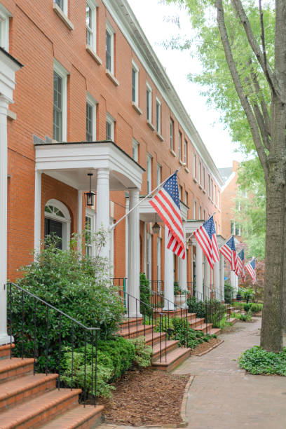 istock Brick Houses with Columns and American Flags 1445795827
