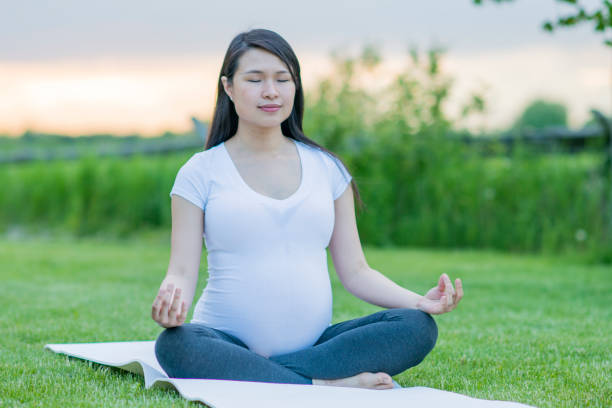 istock Pregnant Woman Practicing Yoga 1445796611