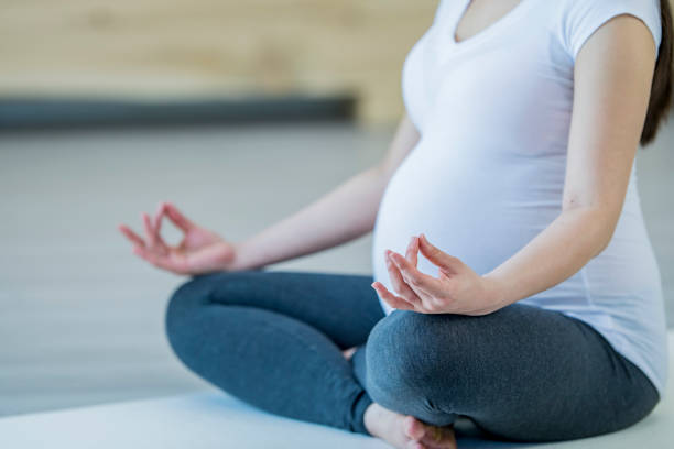 istock Pregnant Woman Practicing Yoga 1445796621