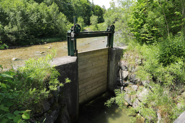 an old small sluice gate - miniature weir imagens e fotografias de stock