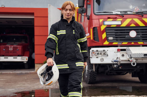istock Walking forward. Woman firefighter in uniform is at work in department 1445797057