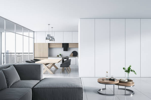 istock Modern white studio interior with panoramic window and city view, furniture and daylight. 3D Rendering. 1445797794
