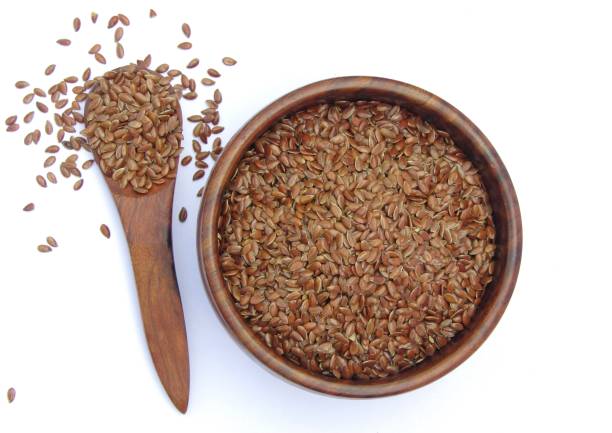 istock flax seeds in a wooden bowl isolated on white background 1445798708