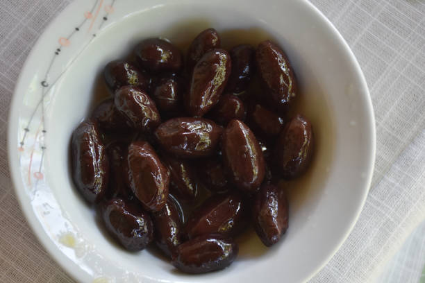 istock Black olives served in white bowl 1445799717