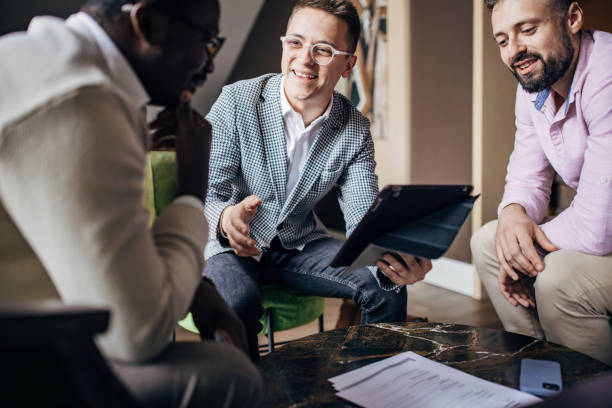 istock Young businessmen in cafe 1445802047