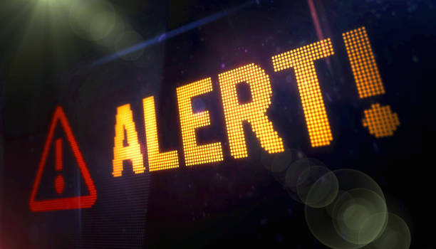istock Alert symbol light flashing on digital display 1445802603