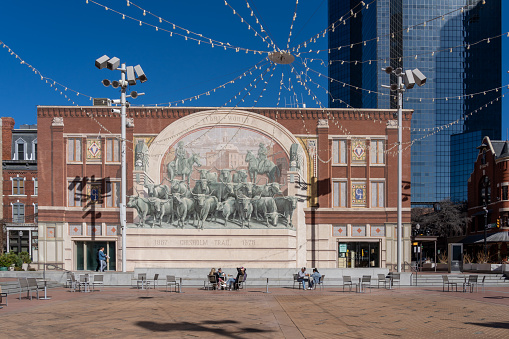Fort Worth, TX, USA - March 19, 2022: Chisholm Trail Mural at Sundance Square in Fort Worth, TX, USA. By Richard Haas, this large mural depicts the famous Chisholm rail’s cattle drives.
