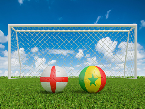Footballs in flags colors on soccer field . England with Senegal. 3d rendering