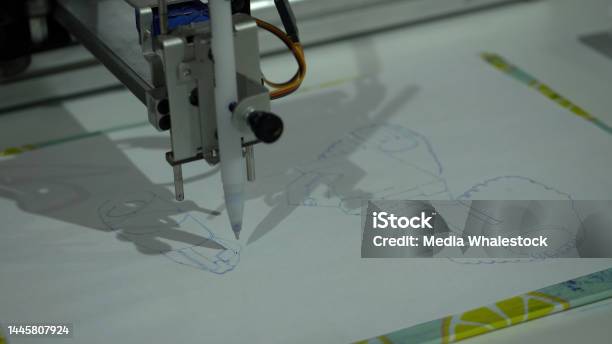 A Machine That Draws Pictures And Graphics Hdr Robot Machine That Draws On A Piece Of Paper Stock Photo - Download Image Now