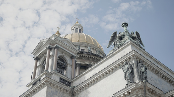 St. Isaac's Cathedral. Action. The beautiful roof of one of the monuments of St. Petersburg, taken from below and against the blue sky. High quality 4k footage