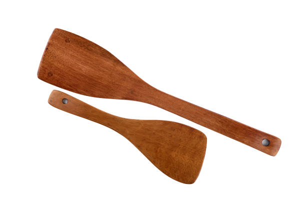 istock Two wooden kitchen spatulas isolated on a white background. 1445809388