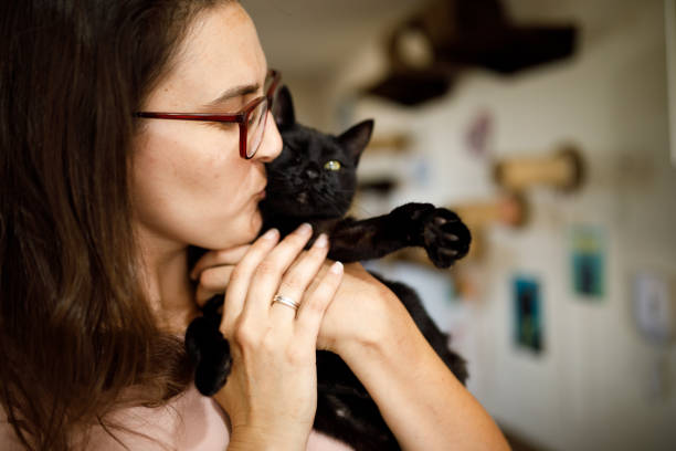 istock Woman kissing her disabled kitten 1445818267