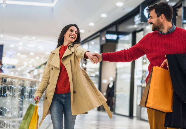 Loving couple in a shopping mall stock photo