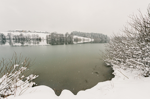 Winter lake in blizzard