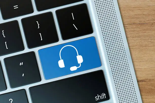 Headset icon on computer keyboard. Call Center Concept.