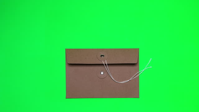 opening the envelop on green background