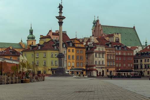 Old Town, Warsaw, Mazovia  - 2022/10/14: Morning panorama of Castle Square with Sigismund III Waza column and colourful tenement houses in Starowka Old Town historic district.  UNESCO World Heritage Site.