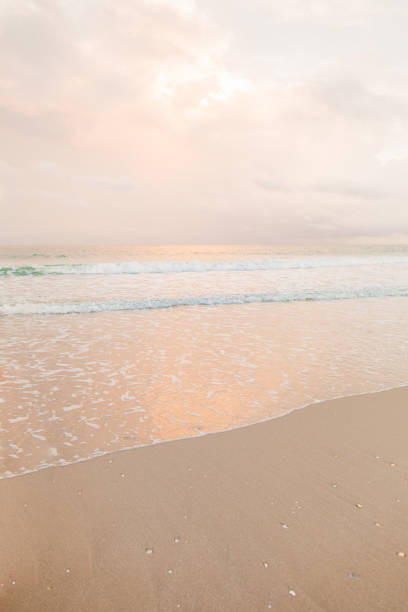 Teal Ocean Waves Sweeping Ashore an Empty Shoreline at Sunset in Singer Island, Florida in the Fall of 2022.
