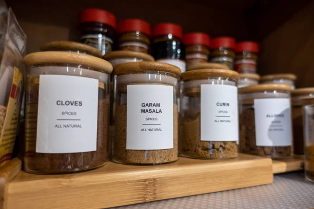 istock Selective focus on blank labeled seasoning jars inside a cupboard in a home kitchen 1445835963