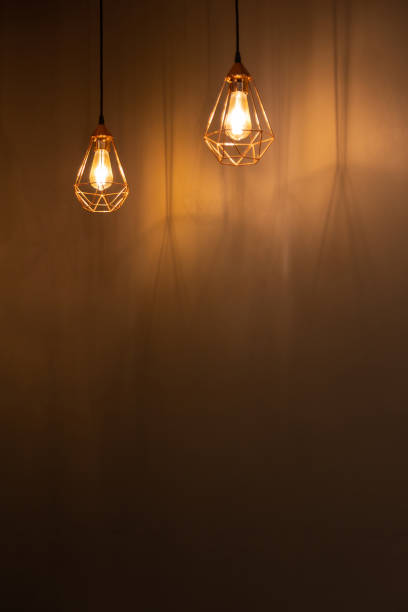 istock Wall background with hanging chandeliers lights and shadows 1445835990