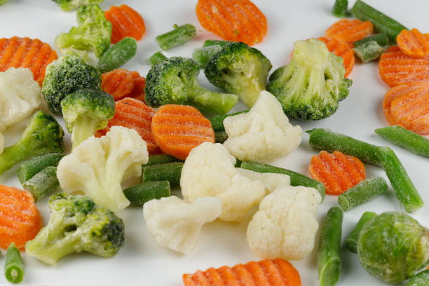 istock Frozen vegetables close-up on a white background. 1445836220