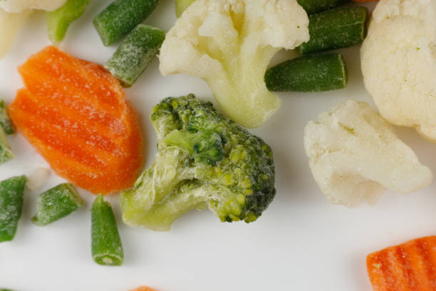 istock Frozen vegetables close-up on a white background. 1445836221