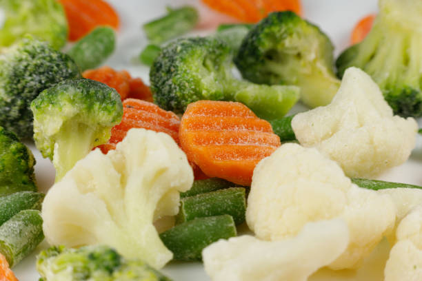 istock Frozen vegetables close-up on a white background. 1445836223