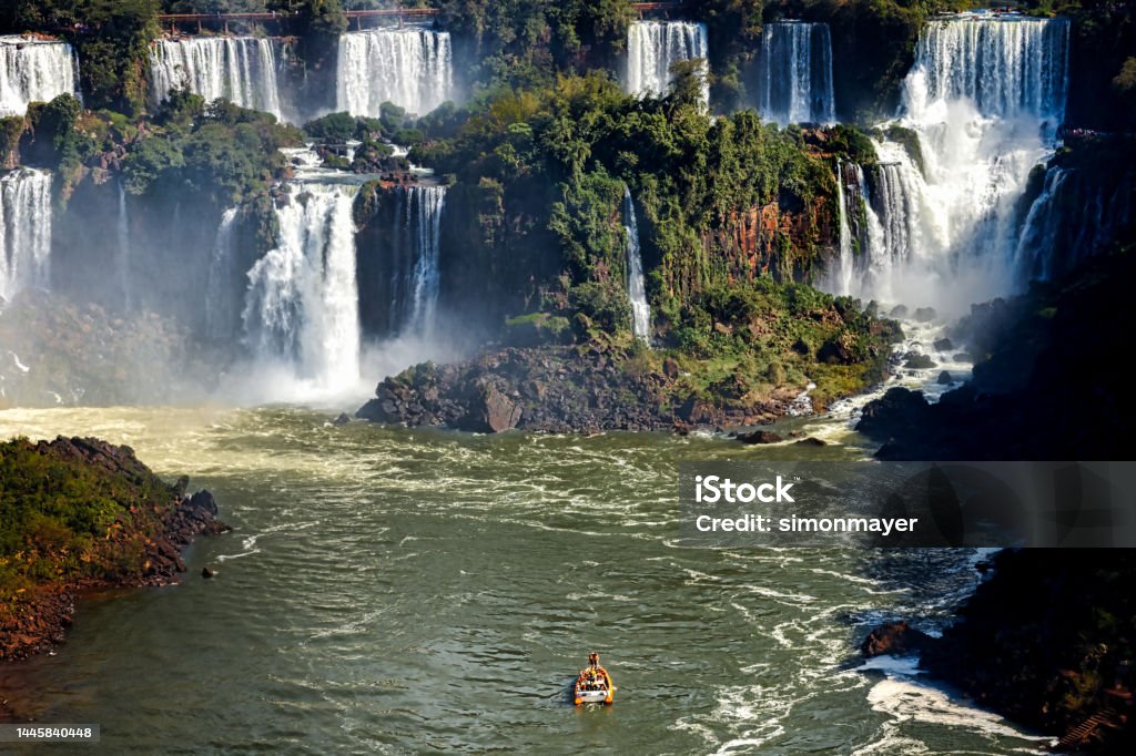 Tourist boat sails towards the Iguazú Falls Iguacu Falls Stock Photo