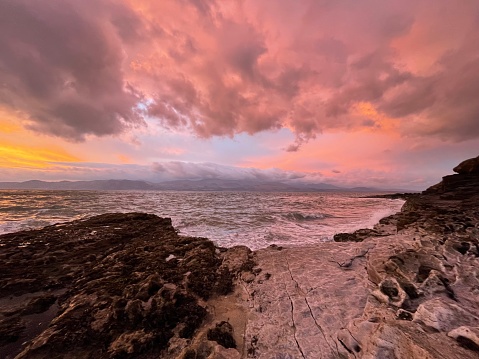 A sunrise with an array of wild and beautiful colours at Penmon Point in North Wales