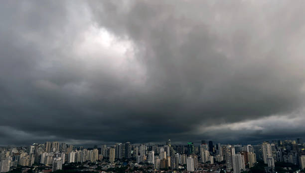 istock Dark and dramatic rain clouds over a city. 1445843494