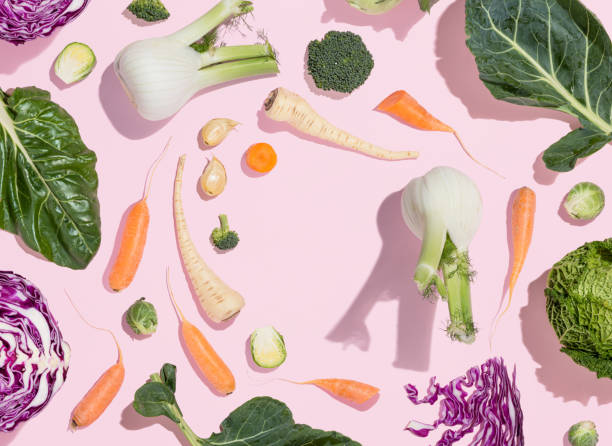 collard greens, swiss chard, carrot, parsnip, radish, broccoli, brussels sprout, kohlrabi, red cabbage, fennel, garlic and kale on pink background. winter vegetable pattern. eating raw food. flat lay. - parsnip vegetable food winter imagens e fotografias de stock