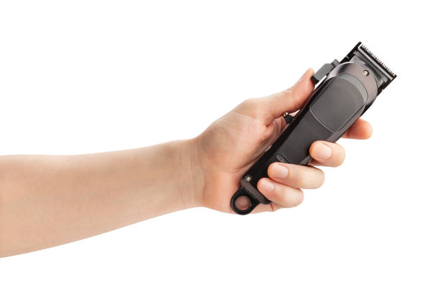 hair clipper in hand