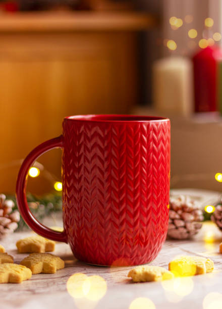 istock close up red cup with a knitted pattern on the table . winter holidays, Christmas, New Year 1445845985