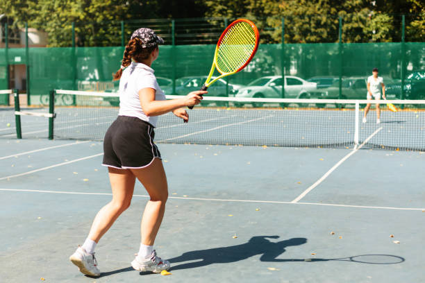 istock Woman playing tennis 1445848373