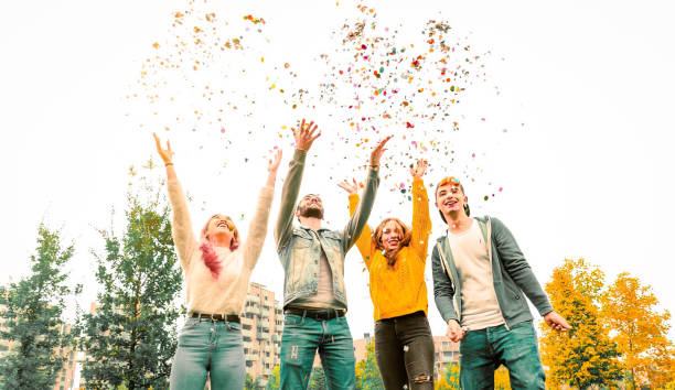 istock Multiethnic teenage ersasmus student group celebrates with confetti. 1445854896