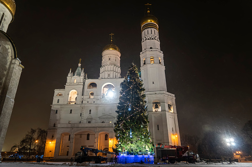 Beautiful Orthodox churches on the territory of the Moscow Kremlin. workers decorate a Christmas tree in the Kremlin. preparation for the new year. The main Kremlin Christmas tree installation.