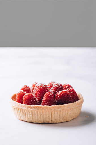 Tart with custard and fresh ripe raspberries