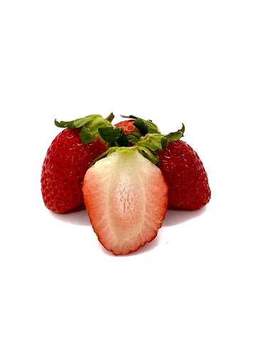 sliced ​​strawberries placed on a white background