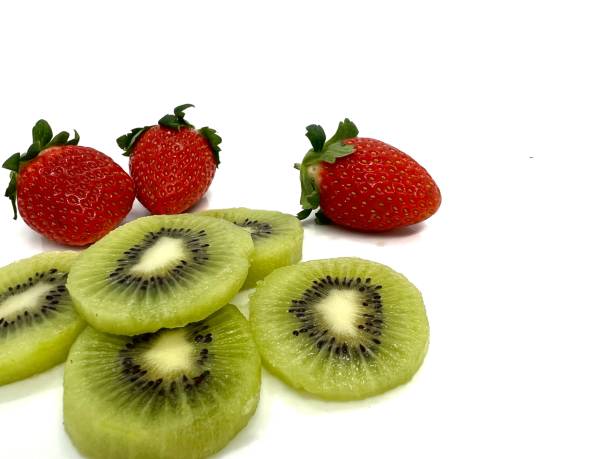 Cut kiwi and strawberry on white background