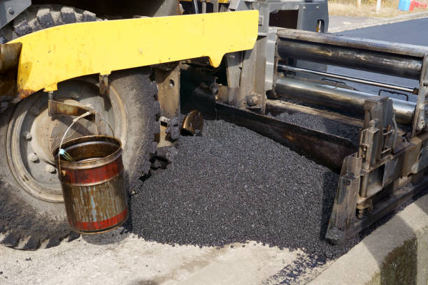 istock asphalt finisher placing a layer of asphalt 1445874783