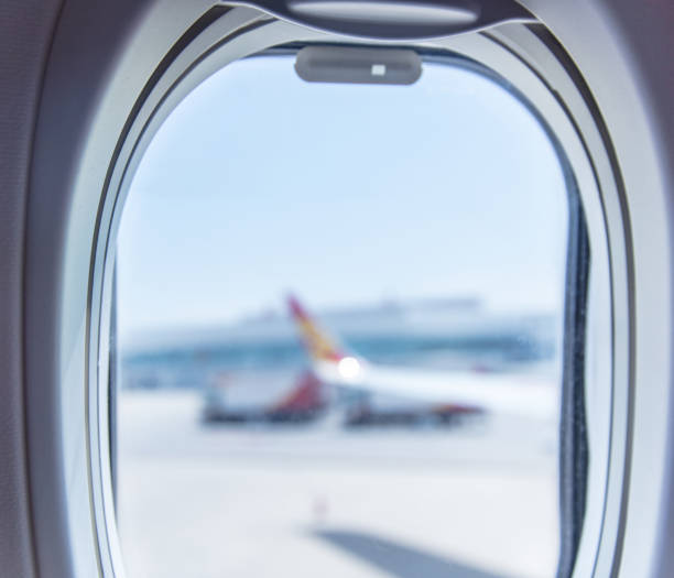 istock Airport seen through airplane window 1445885606