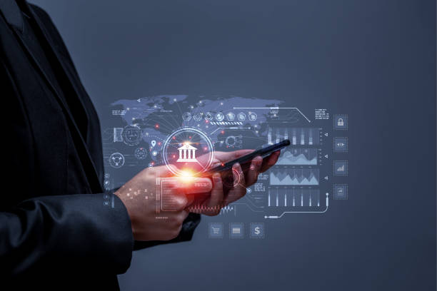 istock Business people using mobile phone to conduct financial transactions through internet all over the world. Concept of cyber banking services for financial transactions, investments through internet. 1445885762