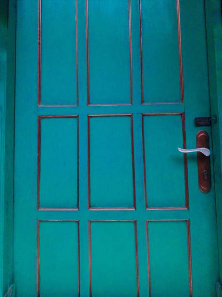istock green painted house door 1445886368