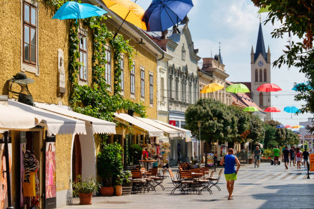 Keszthely, Hungary - August 24, 2018: Kastey Street is a lovely pedestrian street leading from the Festetics Palace towards the catholic Church of Our Lady of Hungary